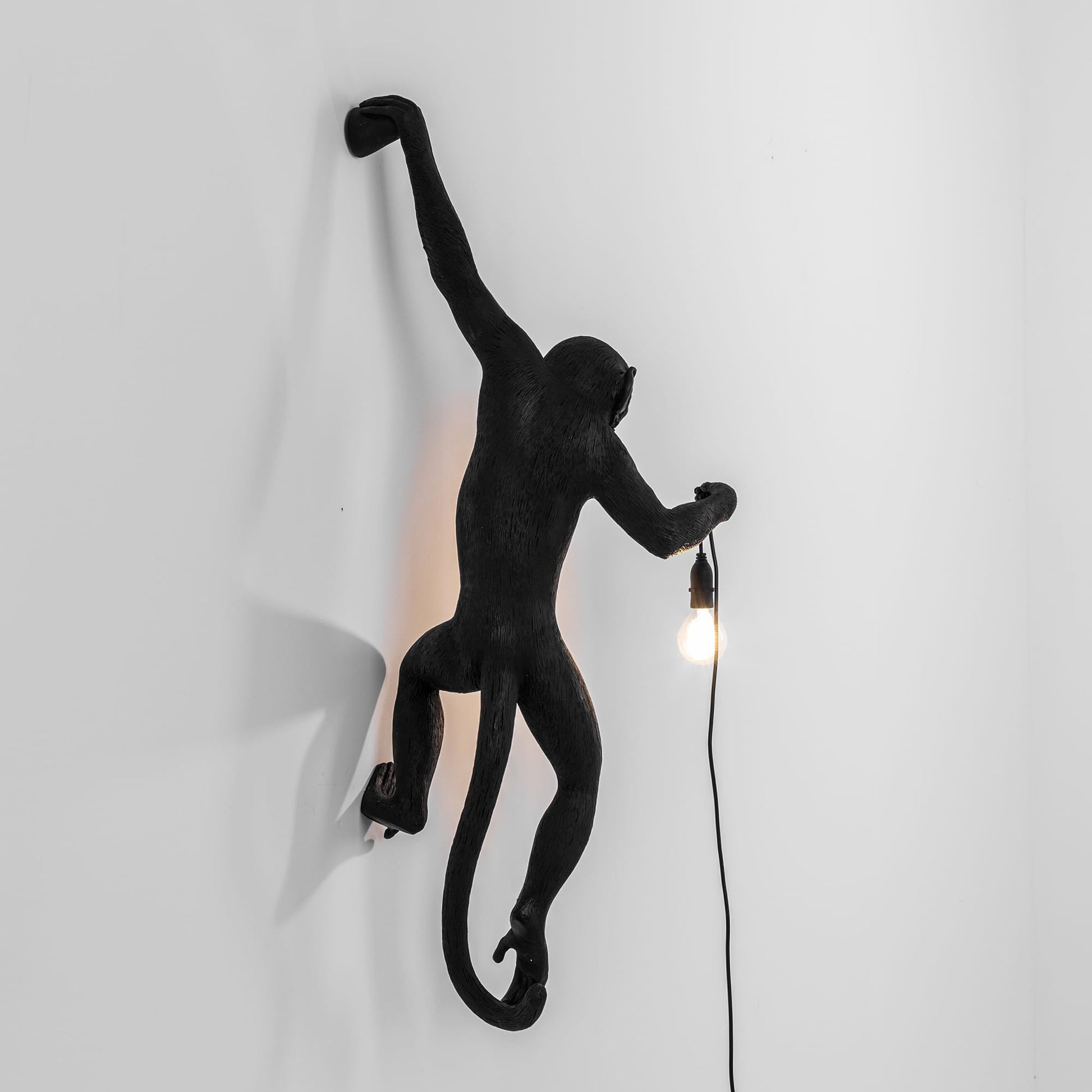 Lampada da muro mano sinistra da esterno nera monkey lamp